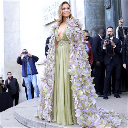 jennifer lopez in a green Elie Saab dress and flower cape