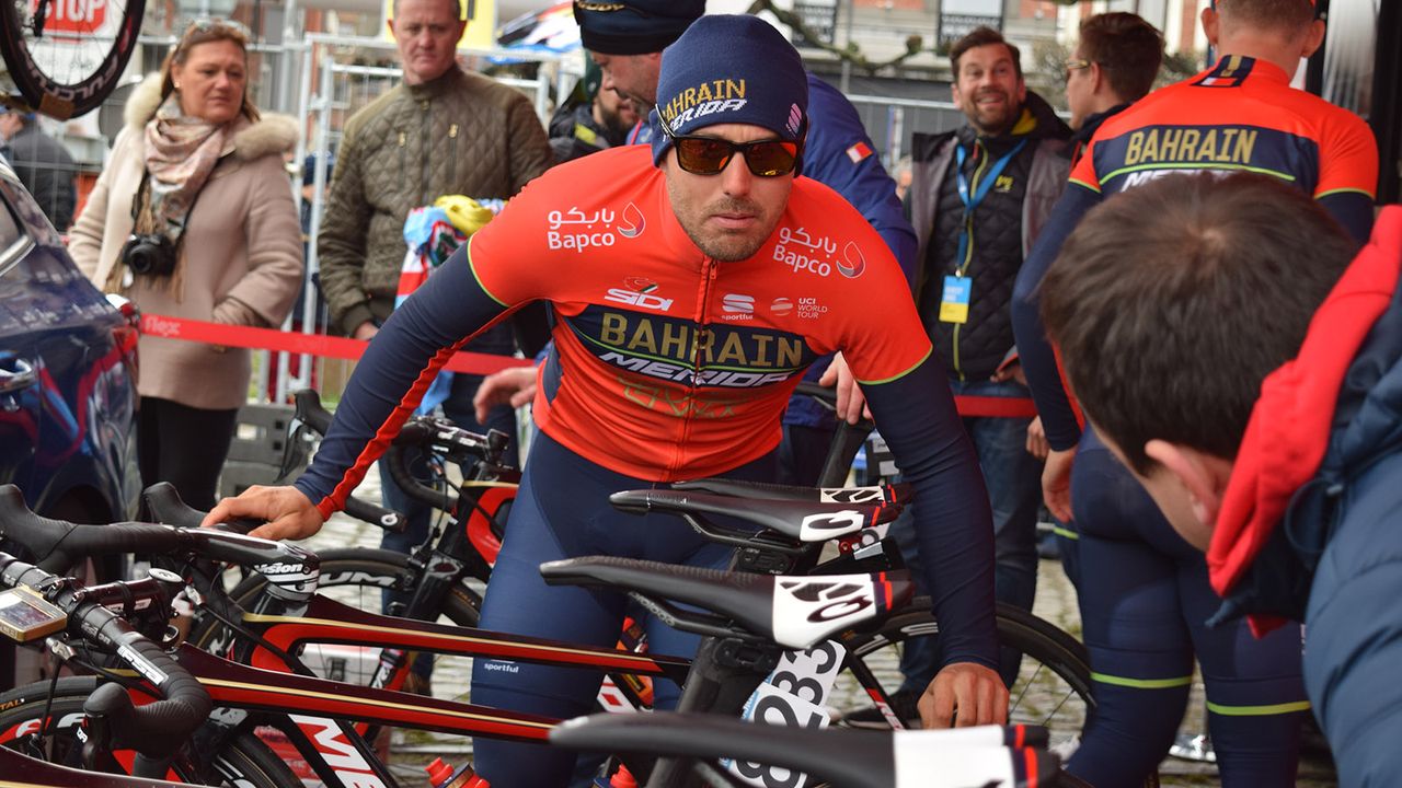 Sonny Colbrelli double checks his tyre pressures with a mechanic after sign on
