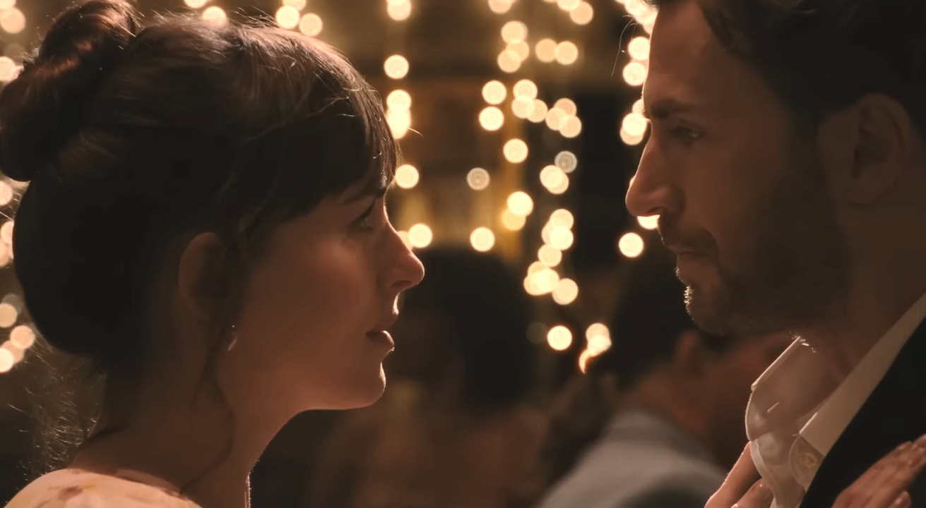 Dakota Johnson and Chris Evans dancing closely in Materialists