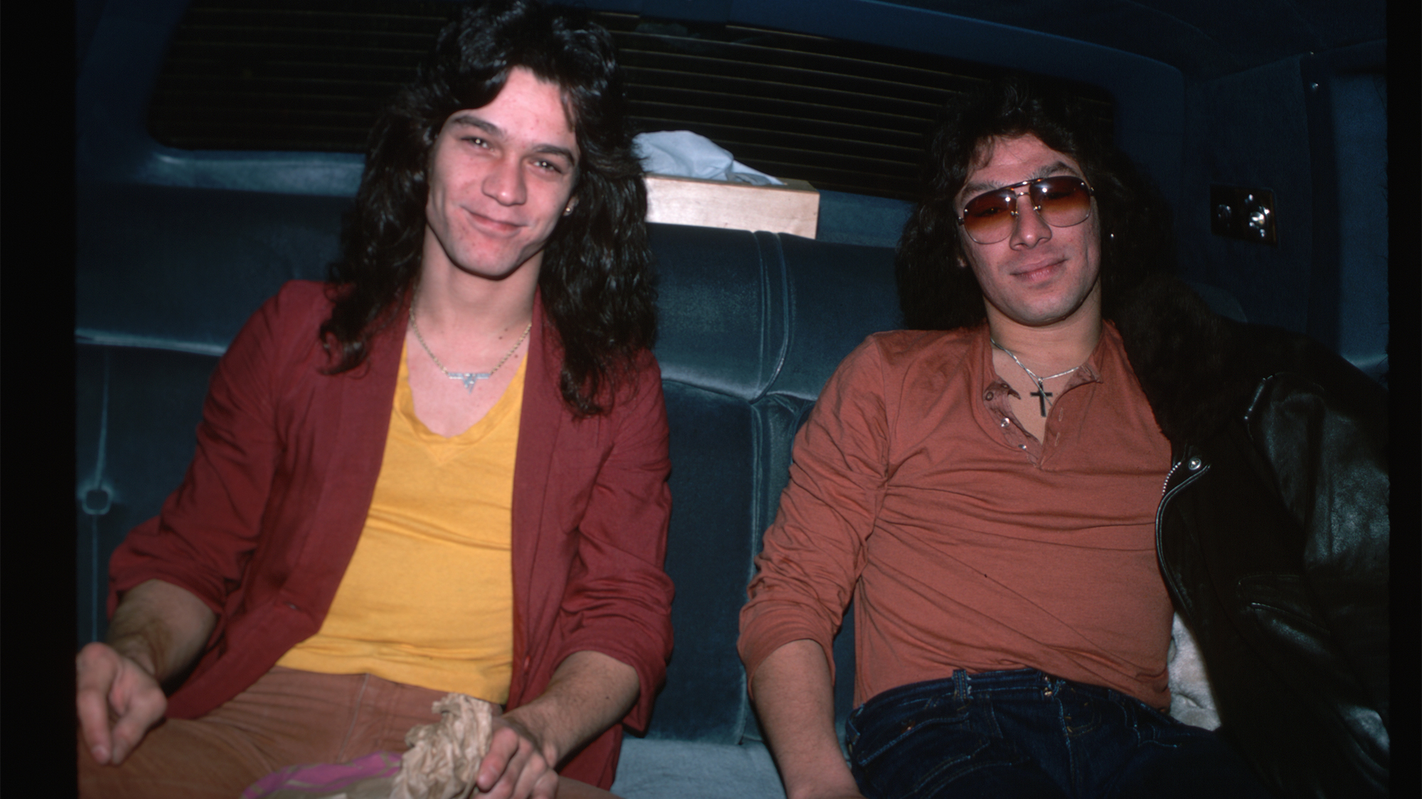 Eddie and Alex Van Halen in the back seat of an automobile. Photograph, 1978.