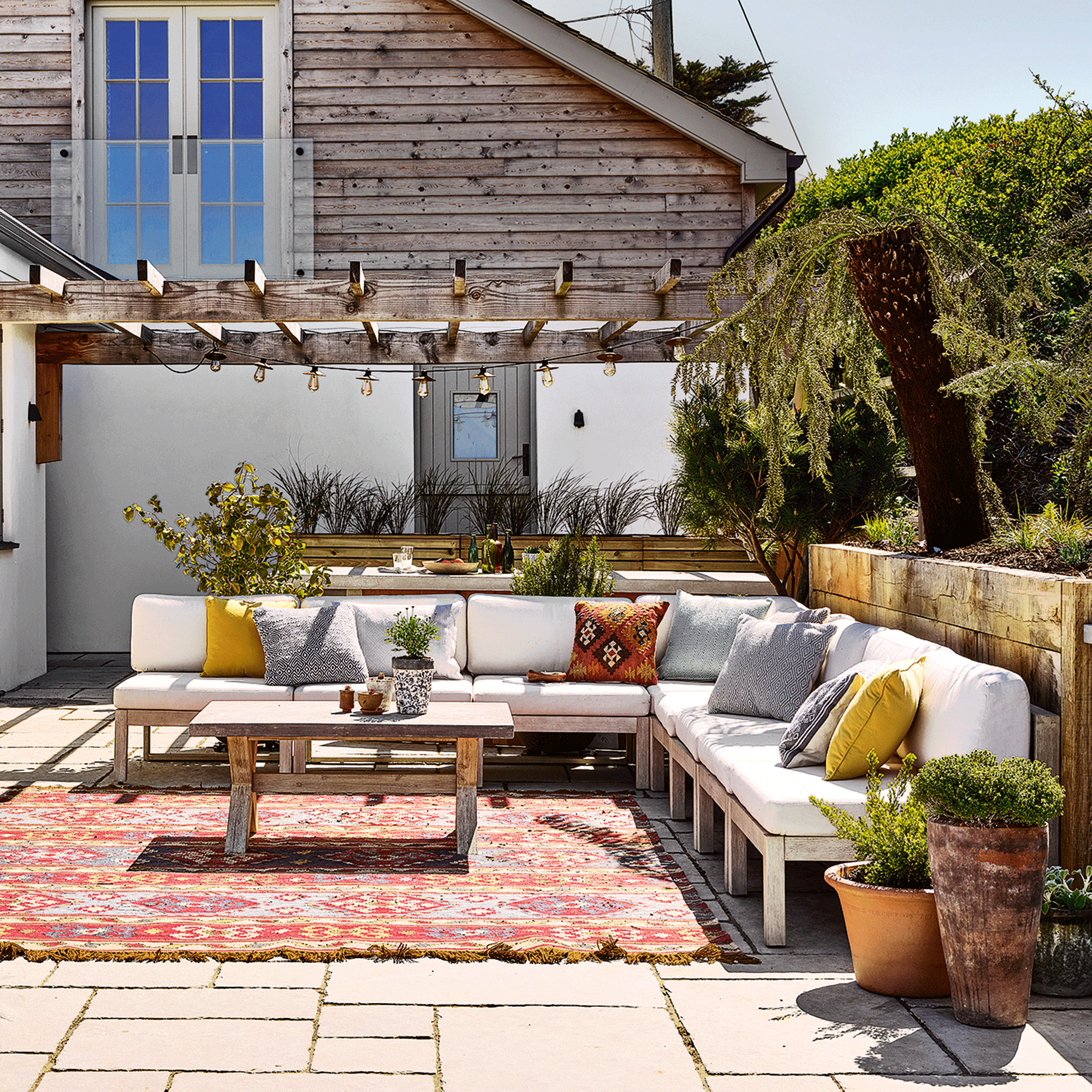 White sofa with outdoor rug
