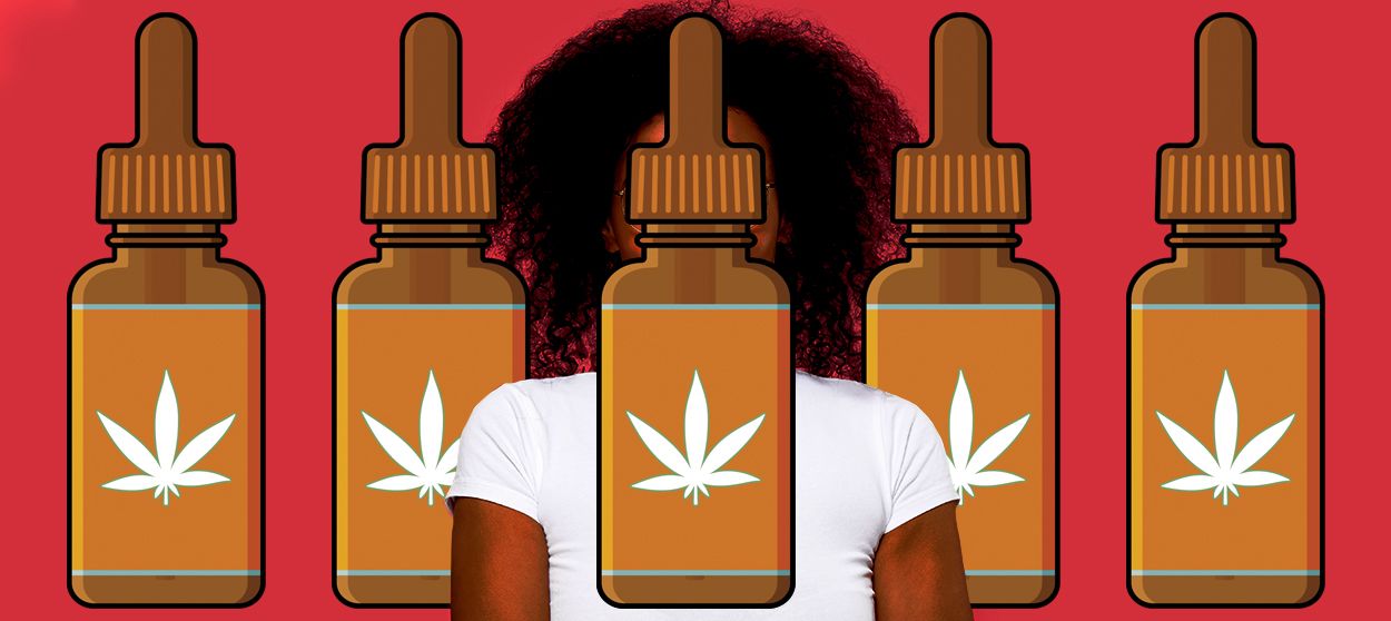 A woman and CBD bottles.