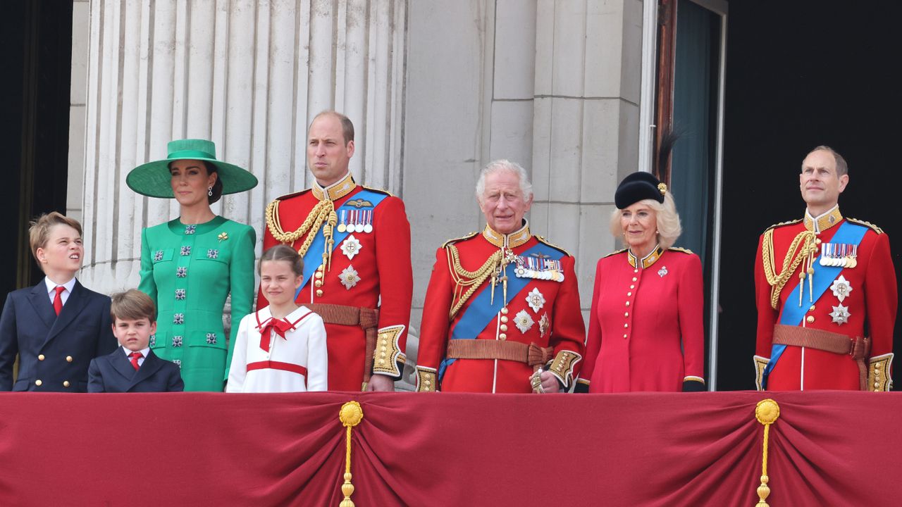 Royals including The King and Queen standing on the balcony in uniforms during Trooping the Colour 2023