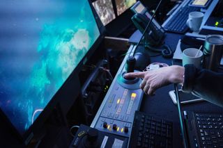 Researchers aboard the Schmidt Ocean Institute vessel Falkor watch the feeds from their remotely operated vehicle in February 2019.