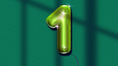 green foil balloon shaped like the number one