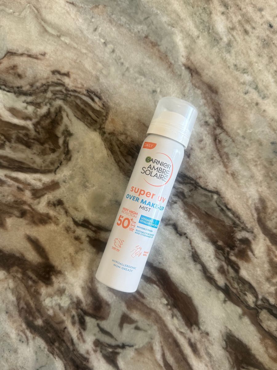 Garnier SPF mist on marble table