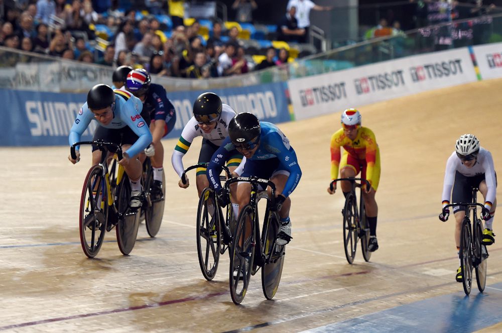 Hong Kong's Lee Wai Sze (C) leads as she approaches the finish line during her heat of the first round session of the Women's Keirin on the fifth day of the 2017 Track Cycling World Championships