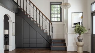 grey painted staircase with built in bespoke understairs storage