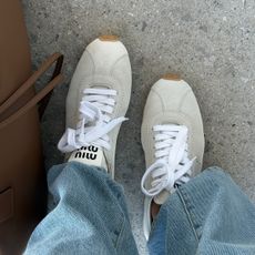 Miu Miu tan suede sneakers with jeans