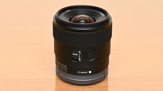 Sony E 11mm F1.8 on a wooden table top
