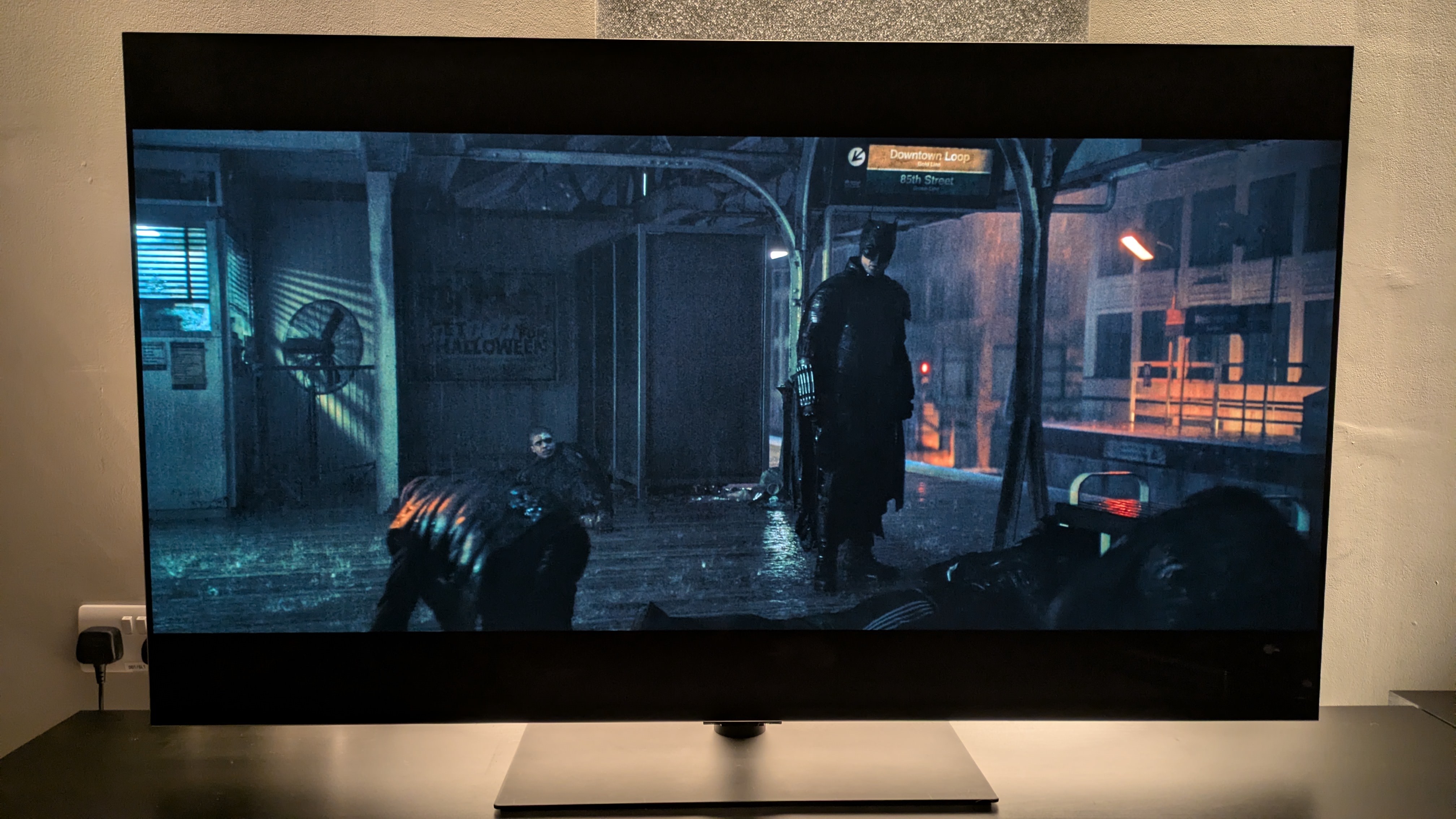 A shot of the subway fight scene from The Batman in Dolby Vision Filmmaker mode in ambient lighting conditions