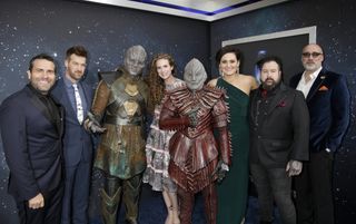 (L to R) James Mackinnon, actor Kenneth Mitchell, a Klingon, actress Clare McConnell, another Klingon, actress Mary Chieffo, creature and concept designer Neville Page and creature and make-up effects designer Glenn Hetrick, arrive on the Red Carpet for the "Star Trek: Discovery" premiere event.