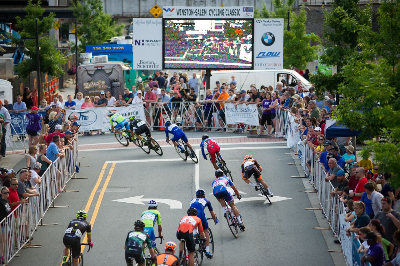 Fans line the first turn.