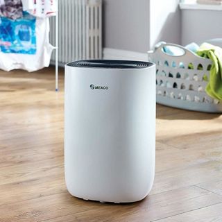 MEACO dehumidifier on wooden floor