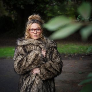 Hasselblad XCD 75P sample image of a woman wearing a fur coat in an rural environment