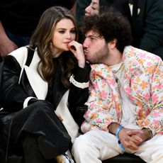 Selena Gomez and Benny Blanco watch a Los Angeles Lakers basketball game