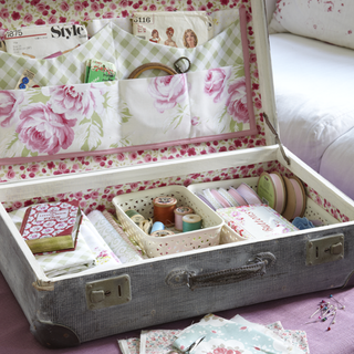 craft room with vintage suitcases and craft kit