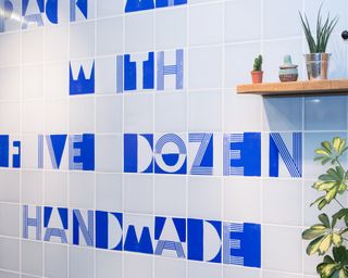 Alphabet motif bathroom tiles by EK Colors