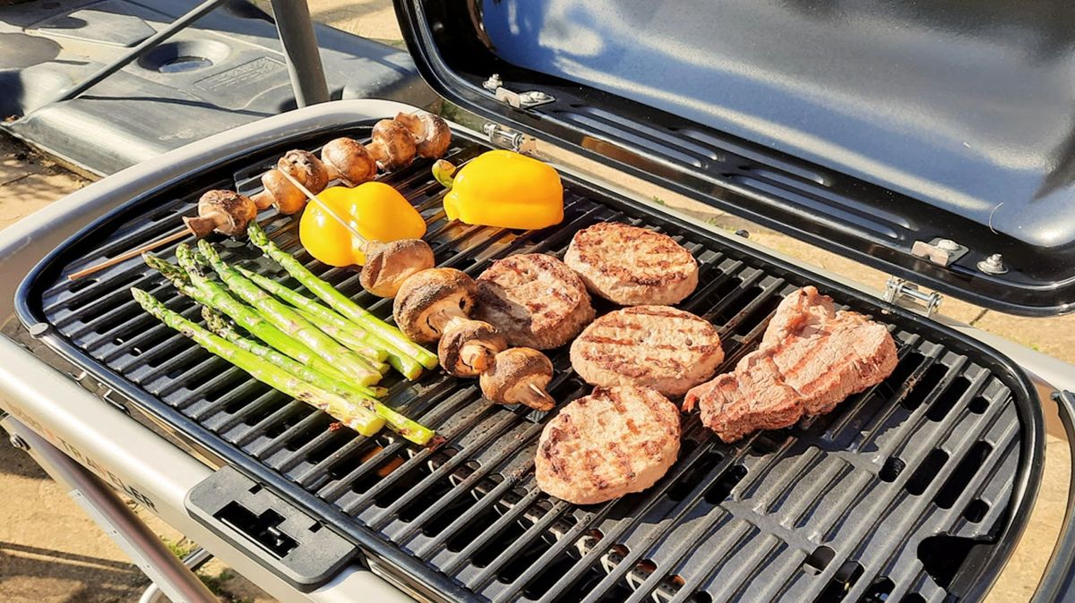 Weber Traveler cooking food during testing