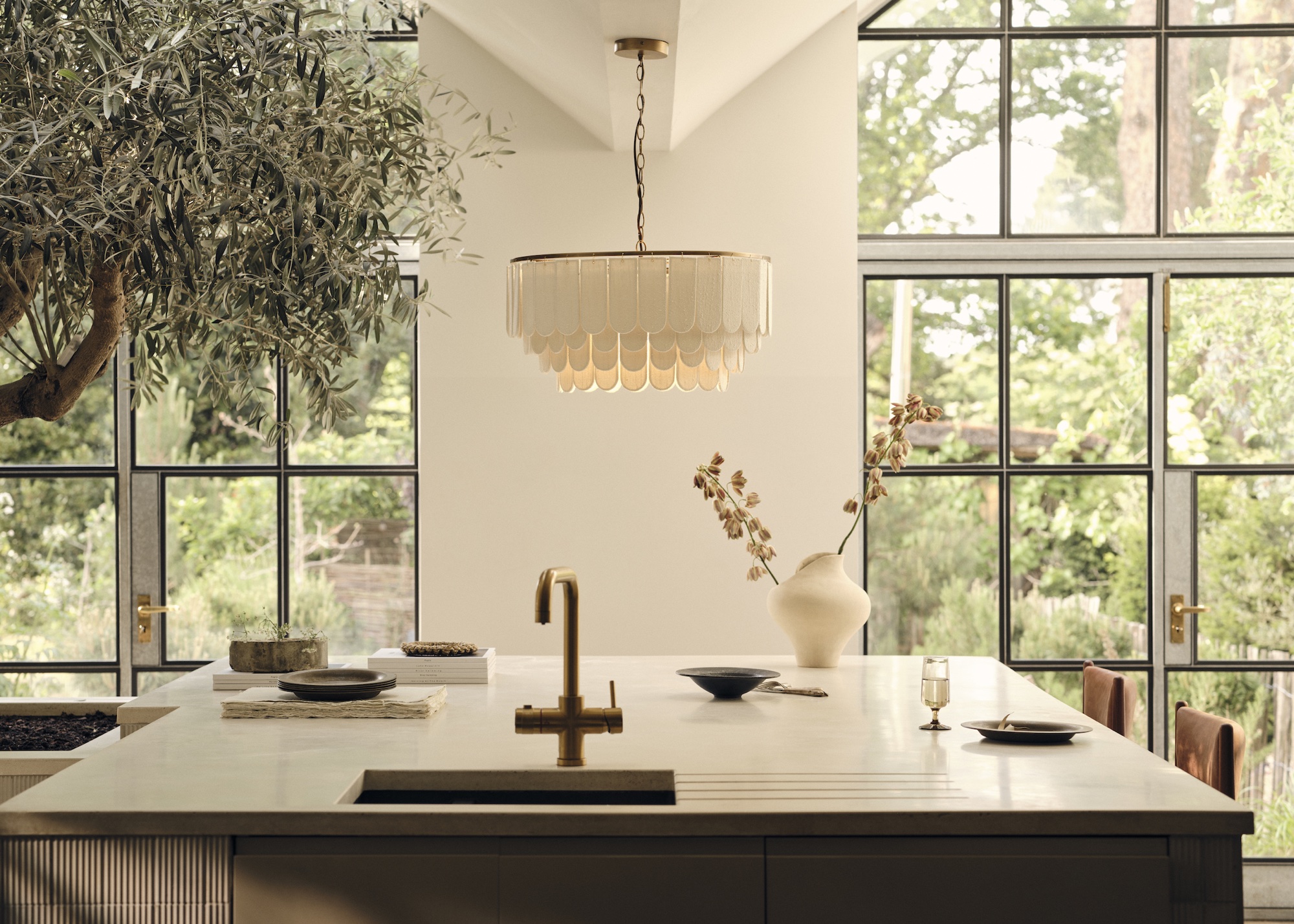 modern kitchen with scalloped chandelier by lights&amp;amp;lamps