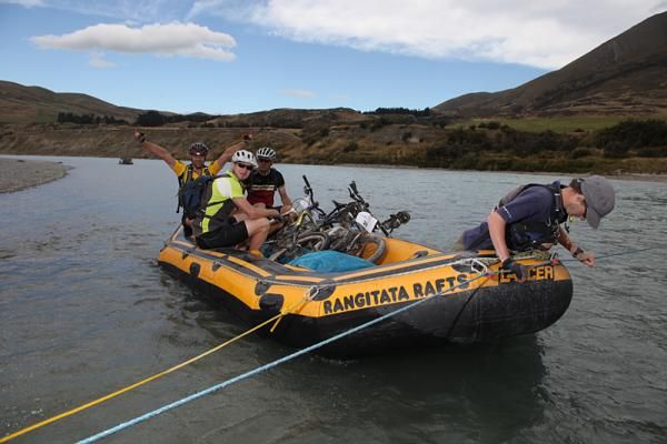 Riders are ferried across the Rangitata River on Wednesday after stage one of the five-stage 2010 Alpine Epic Multi-Stage Mountain Bike Race.