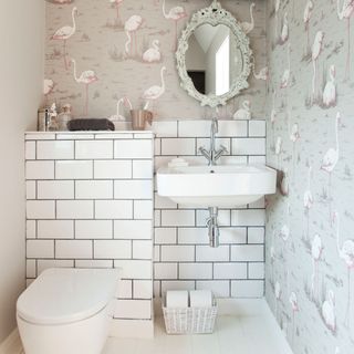 toilet with flamingo wallpaper commode and wash basin