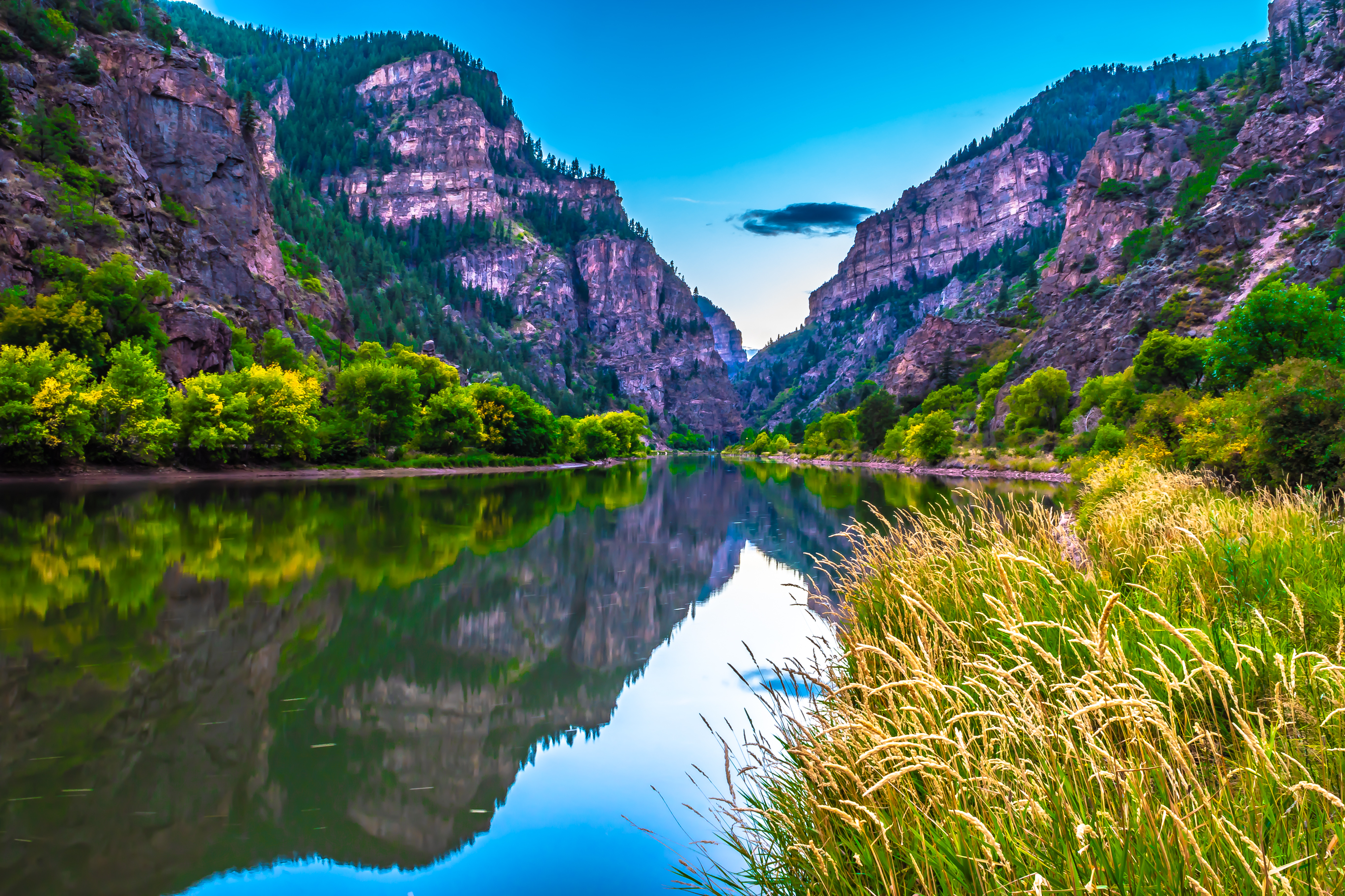 Beautiful Fall Sunset Hike at Hanging Lakes in Glenwood Springs, Colorado. The Zephyr train runs through Glenwood Springs.