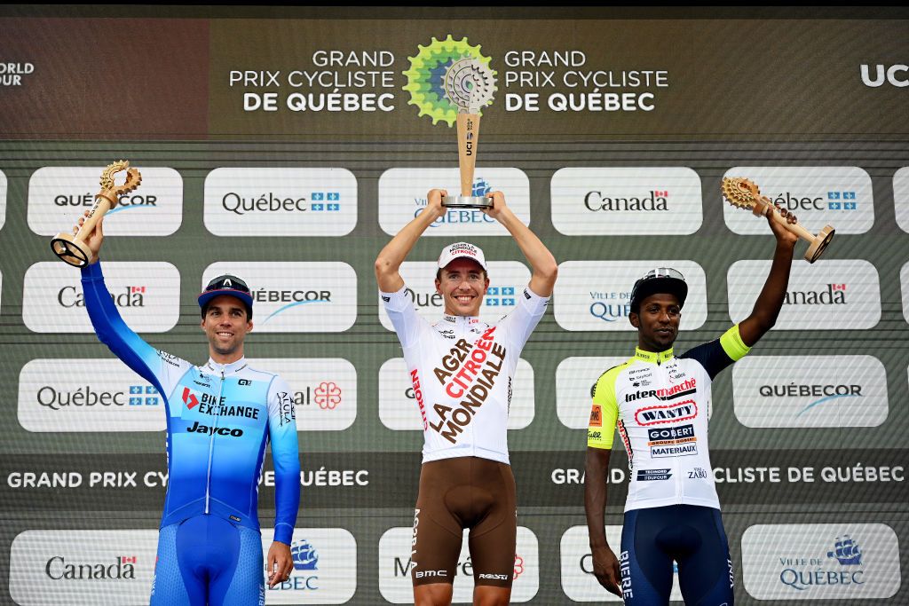 QUEBEC CITY QUEBEC SEPTEMBER 09 LR Michael Matthews of Australia and Team BikeExchange Jayco on second place race winner Benoit Cosnefroy of France and Ag2R Citroen Team and Hailu Biniam Girmay of Eritrea and Team Intermarch Wanty Gobert Matriaux on third place pose on the podium during the podium ceremony after the 11th Grand Prix Cycliste de Qubec 2022 a 2016km one day race from Quebec to Quebec GPCQM on September 09 2022 in Quebec City Quebec Photo by Dario BelingheriGetty Images
