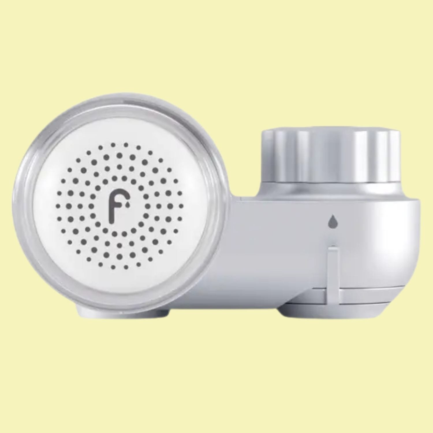 A chrome skincare filter for a faucet against a light yellow background
