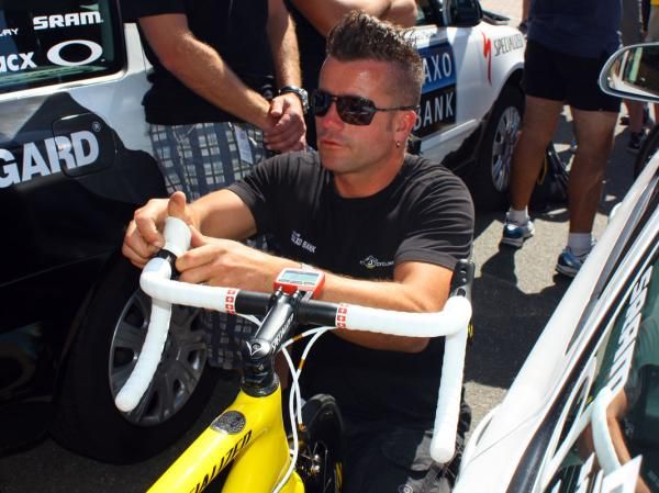 Saxo Bank team mechanic Roger Theel swaps out Cancellara's white brake hoods for yellow ones prior to setting off on Stage 1.