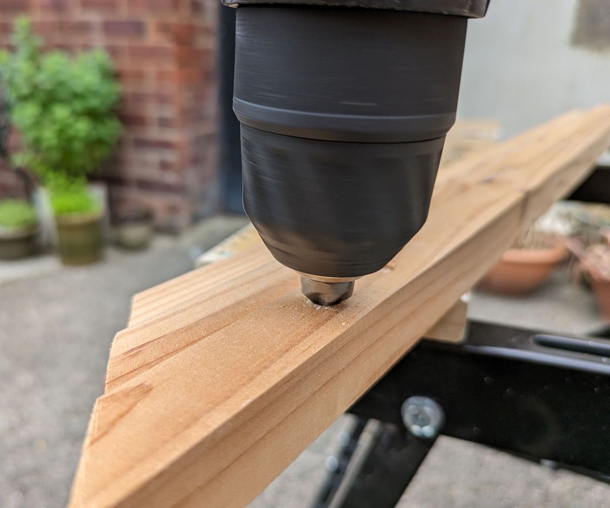 Black &amp; Decker combi drill drilling into wood