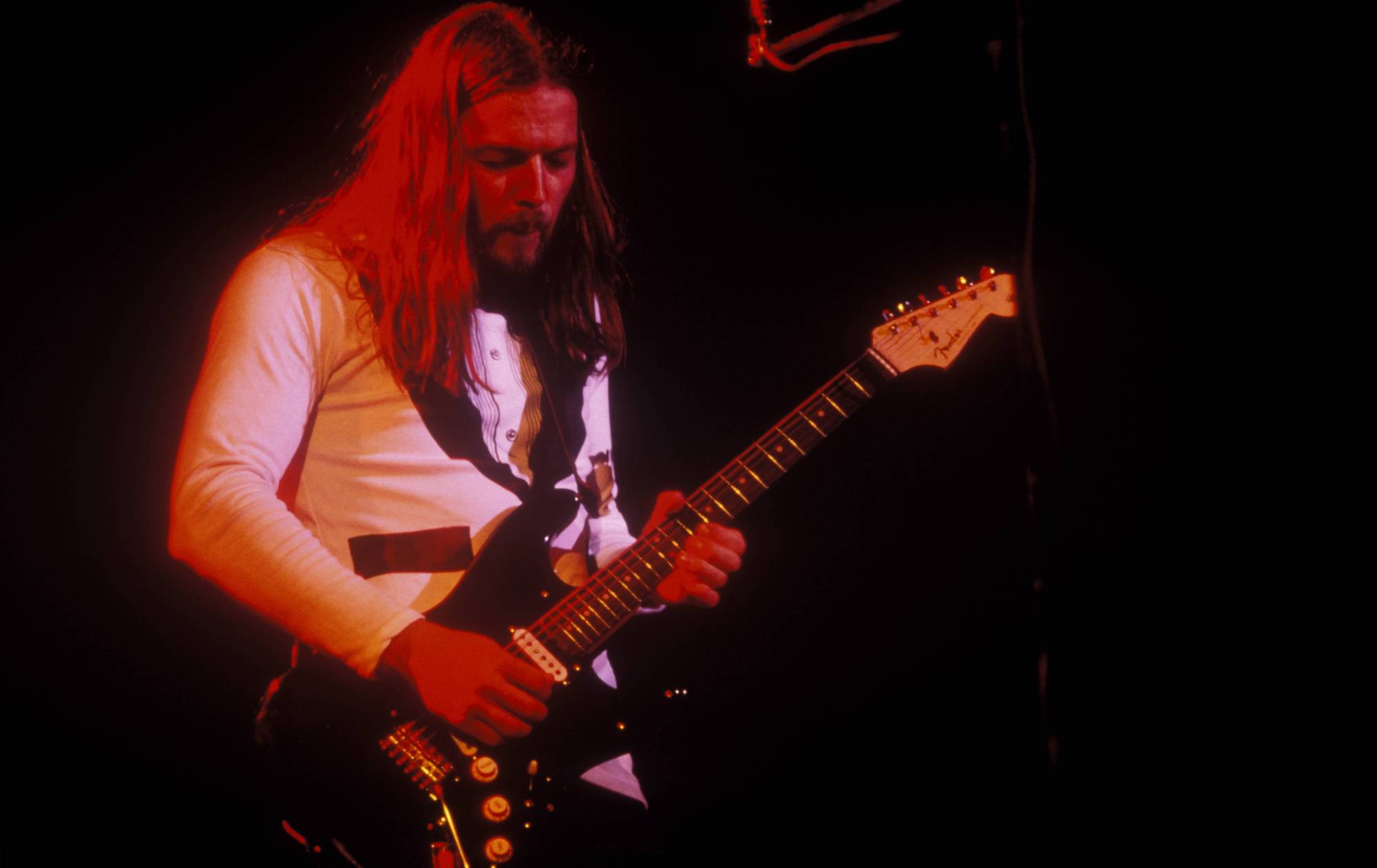 David Gilmour performs onstage with Pink Floyd at the Wembley Empire Pool in London on March 1, 1977
