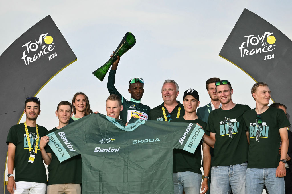 Intermarche - Wanty team's Eritrean rider Biniam Girmay celebrates on the podium with the best sprinter's green jersey after the 21st and final stage of the 111th edition of the Tour de France cycling race, a 33,7 km individual time-trial between Monaco and Nice, on July 21, 2024. (Photo by Marco BERTORELLO / AFP) (Photo by MARCO BERTORELLO/AFP via Getty Images)