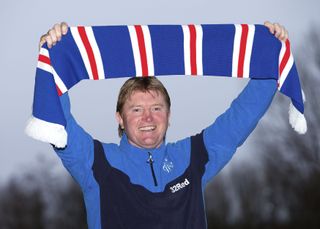 Stuart McCall poses with a Rangers scarf