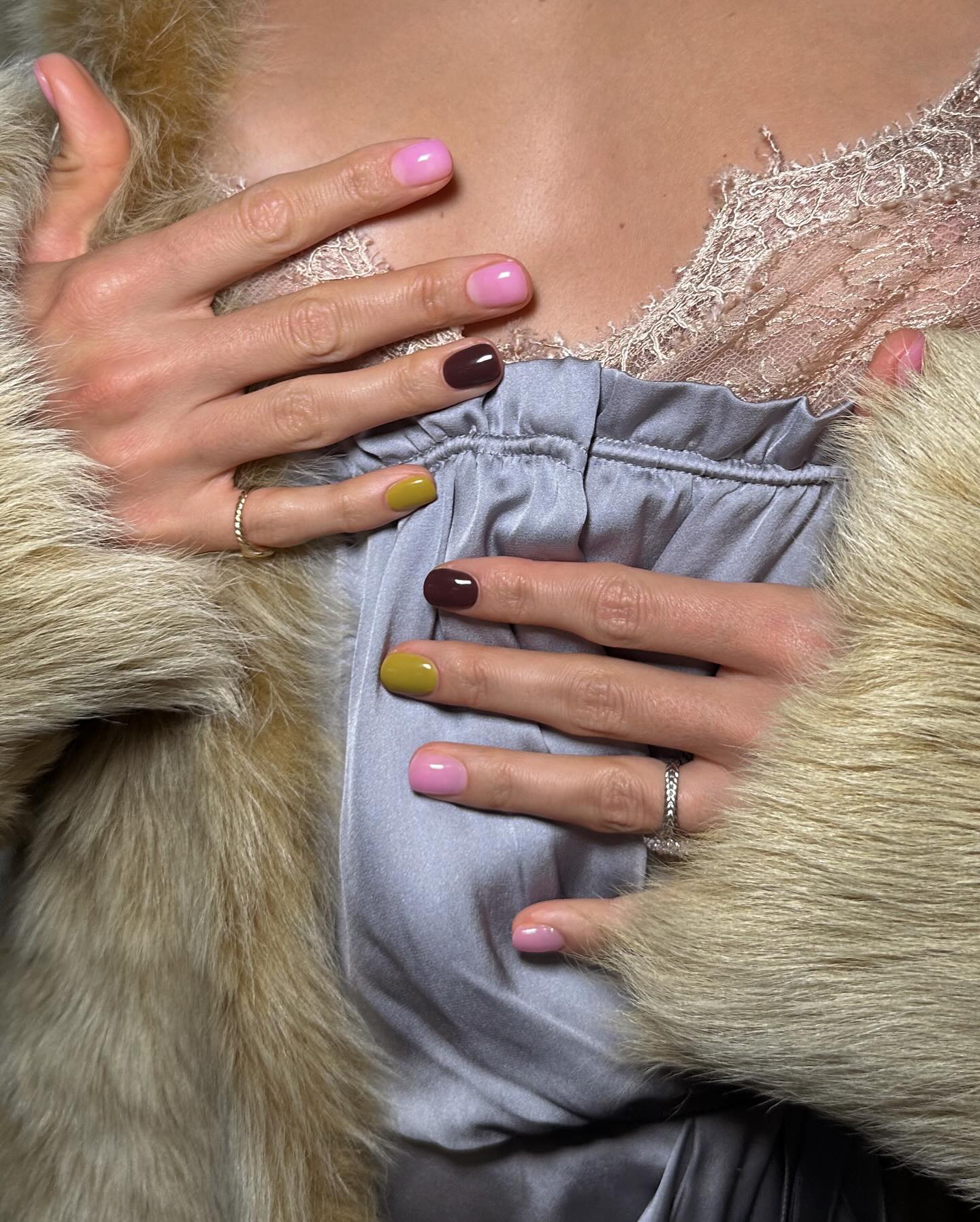 Mismatched brown, pink, and matcha green nails.