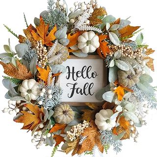 A full faux leaf and pumpkin autumn wreath with a 'hello fall' ign in the center