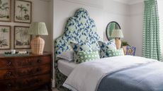 Grey bedroom with green bed