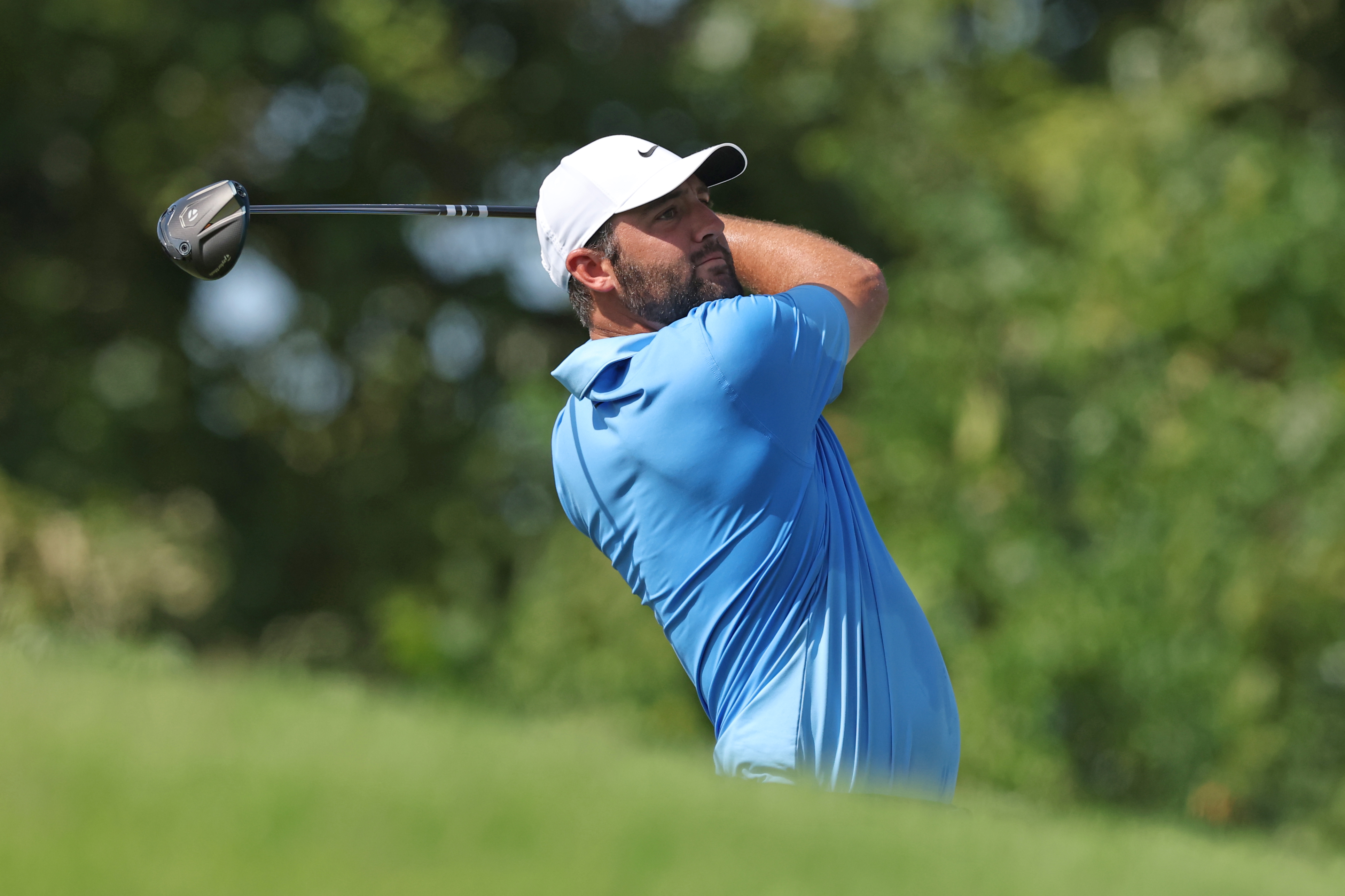 Scottie Scheffler holds his finish on a drive