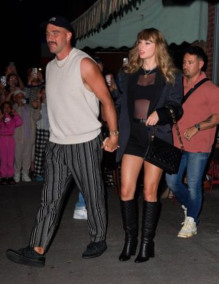 Travis Kelce and Taylor Swift hold hands while leaving the Brooklyn restaurant Lucali and Taylor Swift wears classic knee high boots