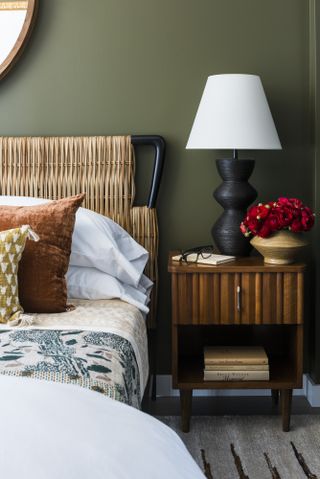 bedroom scheme with dark olive green paint