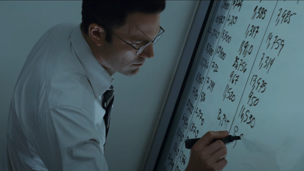 Ben Affleck writing calculations on a white board in The Accountant.