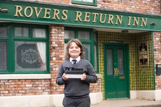 Jude Riordan standing outside the Rovers holding a TV Times Awards