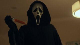 Ghostface with a bloody knife in Scream 2022 