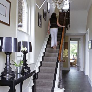 hallway with women and white walls