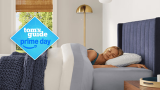 A person sleeping on the Tempur-Pedic Tempur Cloud pillow in a brightly lit room