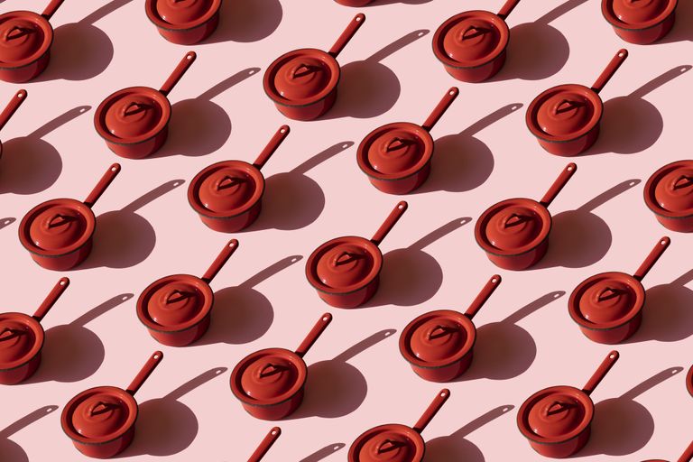 Best induction pans: lots of red pans on a pink background