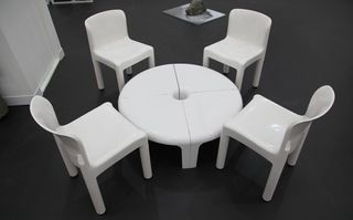 White set of chairs with a circle shaped table