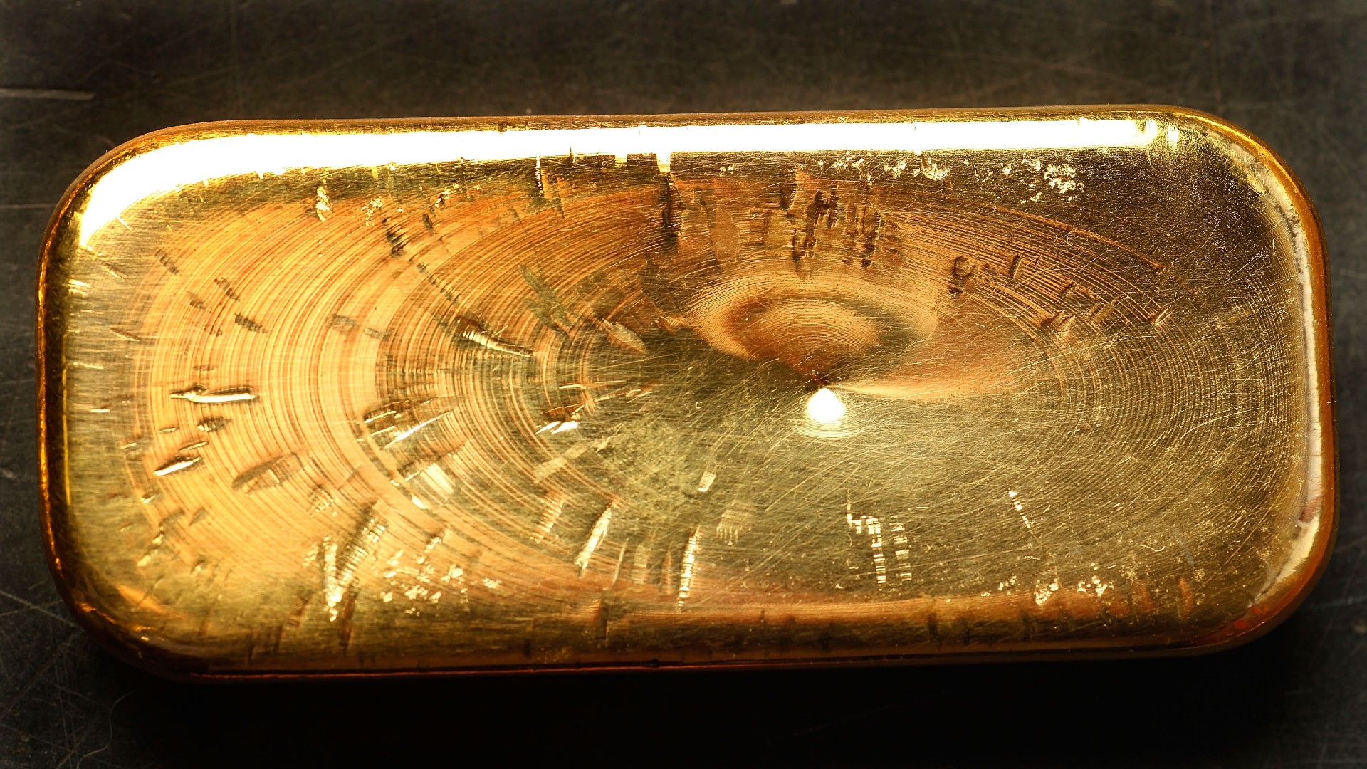 A detail of an ingot of recycled gold bullion displayed at the workshop of 'Gold By Gold', on January 28, 2012 in Paris, France.