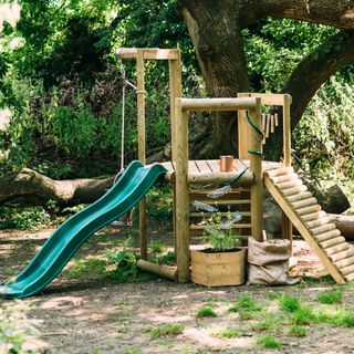 garden with plain and roller slides for kids