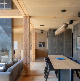 The dining area adjoins the kitchen, underneath the mezzanine